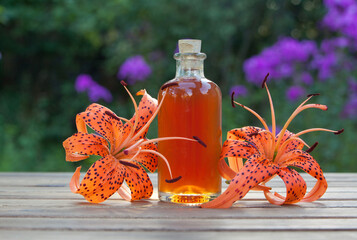 lily essential oil in  beautiful bottle on table