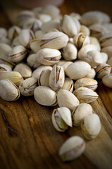 Closeup Details of Pistachios Nuts on Wood Table