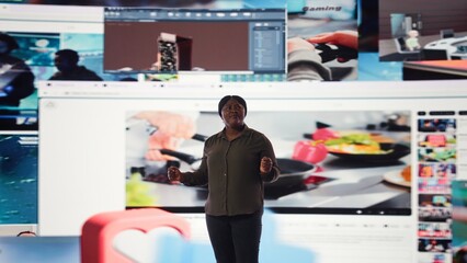 User interacting with trending online videos feed on digital platforms. Woman looks at virtual video wall featuring global channels streaming dashboard with viral clips playlist, camera A