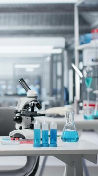 Vertical video Sterile empty medical laboratory workspace featuring test tube racks on workbench. Clean research facility interior free of contamination with nobody in, ready for scientific work