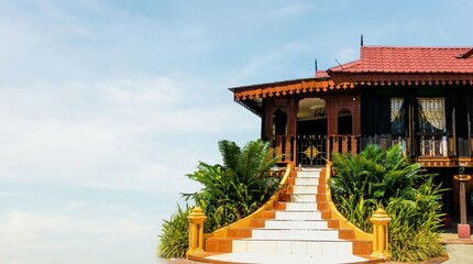 A wide cinematic composition featuring a traditional Malay wooden stilt house in Malaysia.
The house is deliberately placed on the left side of the frame, allowing a large, clean, and dramatic negativ
