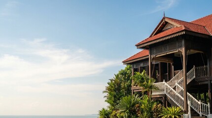 A wide cinematic composition featuring a traditional Malay wooden stilt house in Malaysia.
The house is deliberately placed on the left side of the frame, allowing a large, clean, and dramatic negativ