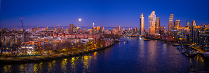 London skyline panoramic sunset with London Eye and City skyscrapers, UK