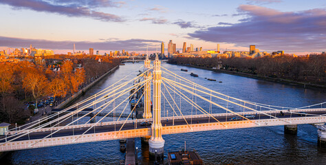 Albert Bridge panoramic view over River Thames at sunset, Chelsea London UK