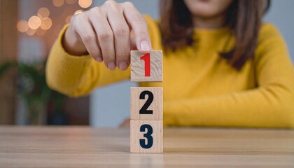 Wooden cubes with numbers first, second, and third. Task priority and management concept. The order of priority in any activity. Set work priority.