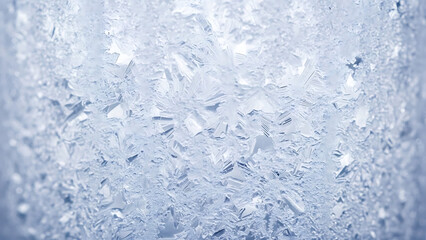 Close-up of intricate frost patterns on a surface, highlighting the delicate crystalline structures formed by freezing water in cold temperatures