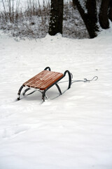 Traditional wooden sled on deep white snow in winter