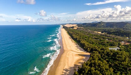 Aerial View of Serene Beach and Coastline Under a Blue Sky with Lush Green Vegetation and Turquoise Water