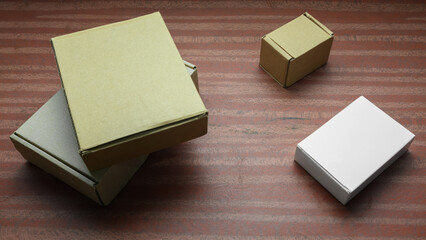 white and craft boxes on a dark wooden table