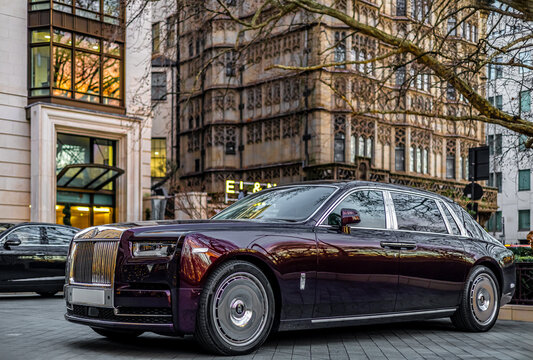 Rolls Royce luxury sedan parked in Mayfair London street in autumn daylight