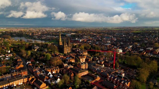 Lichfield Cathedral aerial view with construction crane and city skyline