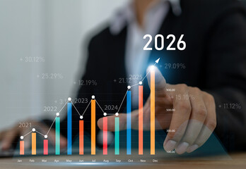 Businessman with digital arrow graph with 2026 year number, business growth, financial plan and strategy for new year 2026, marketing and profit, corporate future success and development concept