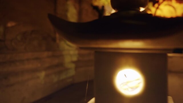 Stone Pagoda Structure Illuminated at Night with Low Angle and Warm Ambient Color expressing Cultural Heritage Concept