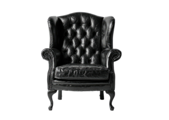 Dark, ornate, leather wingback chair with diamond tufting on a black background