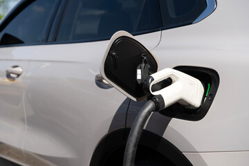Electric Car Charging Close Up with Plug Connected to EV for Clean Energy Transportation