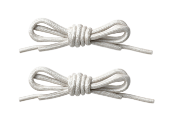 Two off-white shoelaces neatly coiled, ends facing outwards, on black backdrop