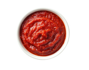 Overhead shot of thick, red sauce filling a small, white ceramic bowl