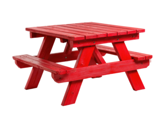 Bright red wooden picnic table against a dark background