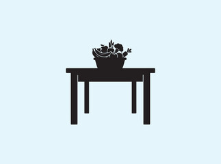 Dining table icon silhouette with produce basket centerpiece
