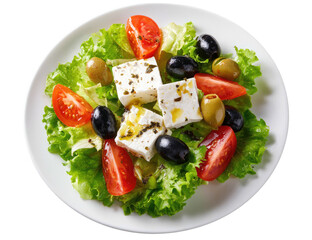 Greek salad on plate feta, lettuce, tomatoes, olives, herb seasoning