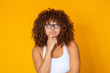 thoughtful young woman deciding isolated in the background