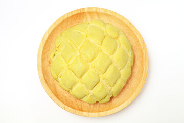 Cantaloupe-flavored pineapple bread on white background