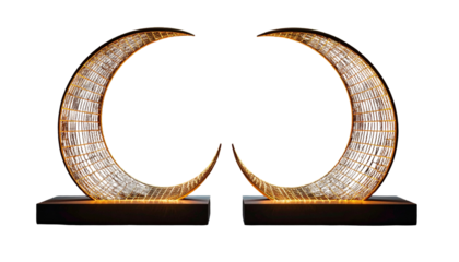 Two illuminated, crescent-shaped structures on a dark backdrop