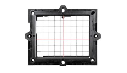 Dark, square device with grid, illuminated crosshairs, and mounting tabs