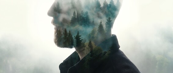 Double exposure silhouette of a man's profile with a misty forest scene blending into his beard and head trees fog nature wilderness serene calm contemplative outdoor landscape spiritual