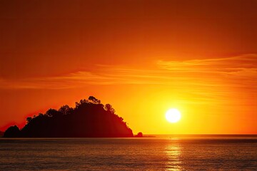 Vivid sunset over ocean with a silhouetted island beneath a fiery sky