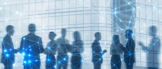 Silhouettes of business people in discussion against a modern glass building overlaid with a glowing blue network of connections and nodes networking communication teamwork technology