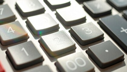 Calculator Keyboard: Close-up of a calculator keyboard, showcasing the crisp and organized arrangement of number keys, a symbol of precision, analysis, and numerical processing.