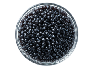 Glossy black pearls fill clear dish, aerial view