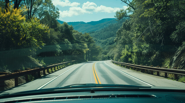 Dashboard view of open road through windshield scenic route
