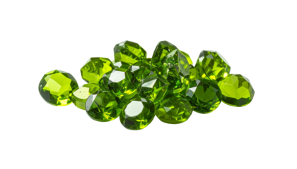 Pile of faceted, vibrant green gems on a stark black background