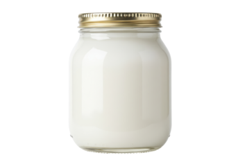 Glass jar filled with creamy white liquid and a golden metal lid