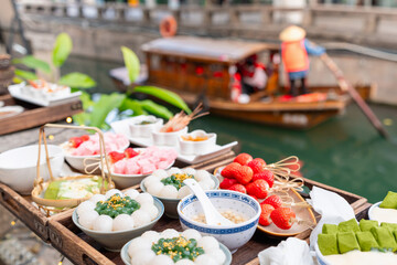 Enjoy local Suzhou sweets and a scenic boat ride along Pingjie Street