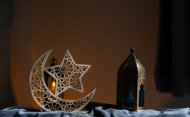 Crescent Star traditional and Ornamental Arabic lantern with burning candle glowing space background well for Muslim holy month Ramadan Kareem, Eid Mubarak, Eid Al Adha, Eid Al Fitr.