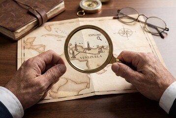 Businessman exploring oil fields on vintage venezuela map using magnifying glass