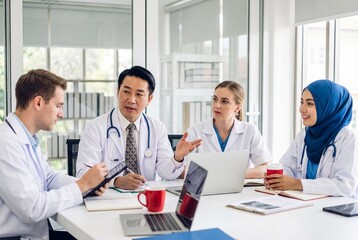 Fototapeta premium Diverse medical team meeting in modern office discussing healthcare strategy