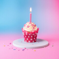 Single birthday cupcake with lit candle and sprinkles on pink background