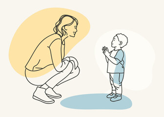 Fototapeta premium A mother crouching and listening to her young son with hands clasped