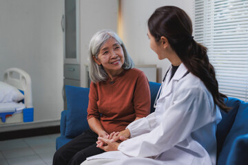 Obraz premium Doctor holding senior woman's hands providing healthcare support