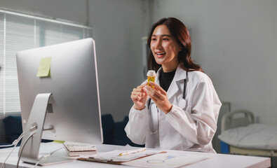 Doctor providing online medical consultation holding medicine bottle