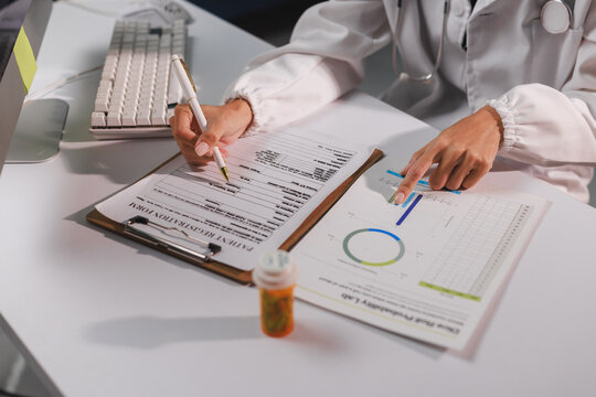 Doctor analyzing patient data, writing medical report - Powered by Adobe