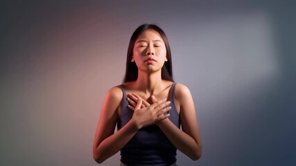 Asian woman finding inner peace through meditation, ideal for mindfulness, relaxation, wellness, meditation, yoga, spirituality, asian culture concepts.