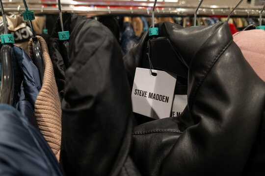 WARSAW, POLAND - JANUARY 5, 2026: Close-up of the Steve Madden brand logo on a tag attached to a black jacket on a rack in a clothing store