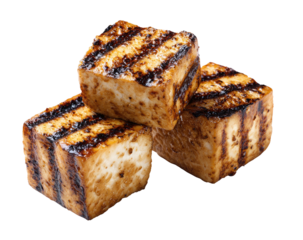 Stack of grilled tofu cubes, showing charred grill marks on each block