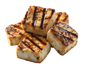 Grilled halloumi cheese cubes stacked on black backdrop; grilled marks visible