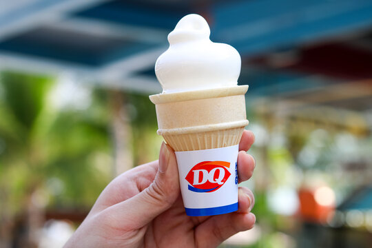 Tangerang, Indonesia - October 11, 2025: Closeup of a hand holding the signature vanilla cone from Dairy Queen.
